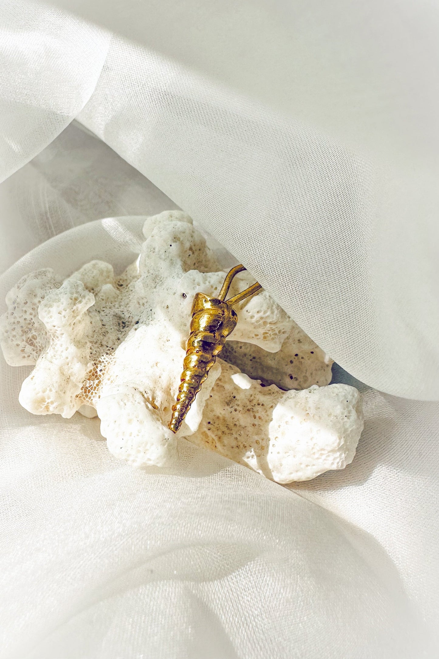 Perirhoe Shell Charm
