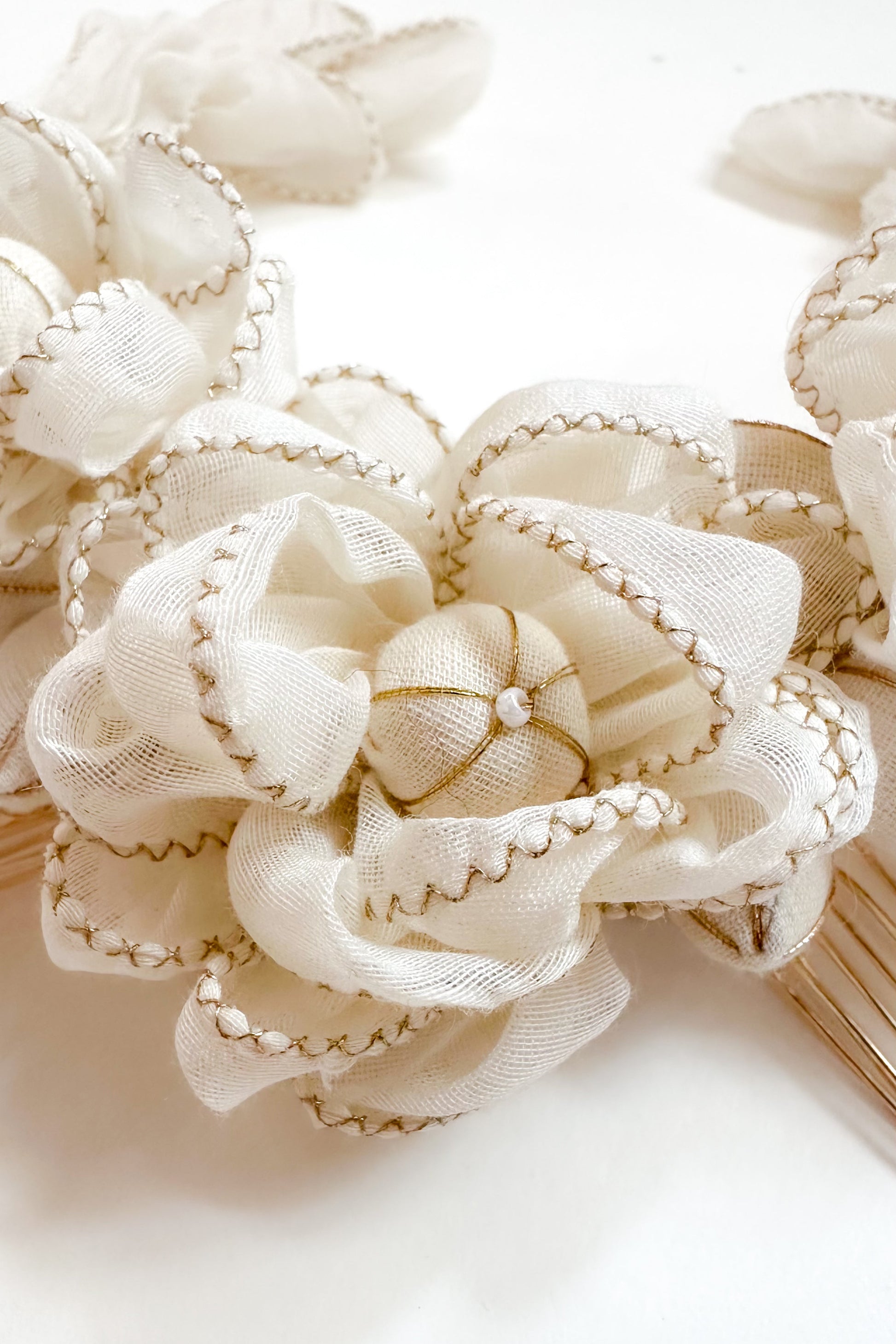 Close-up of a decorative comb clip a white background