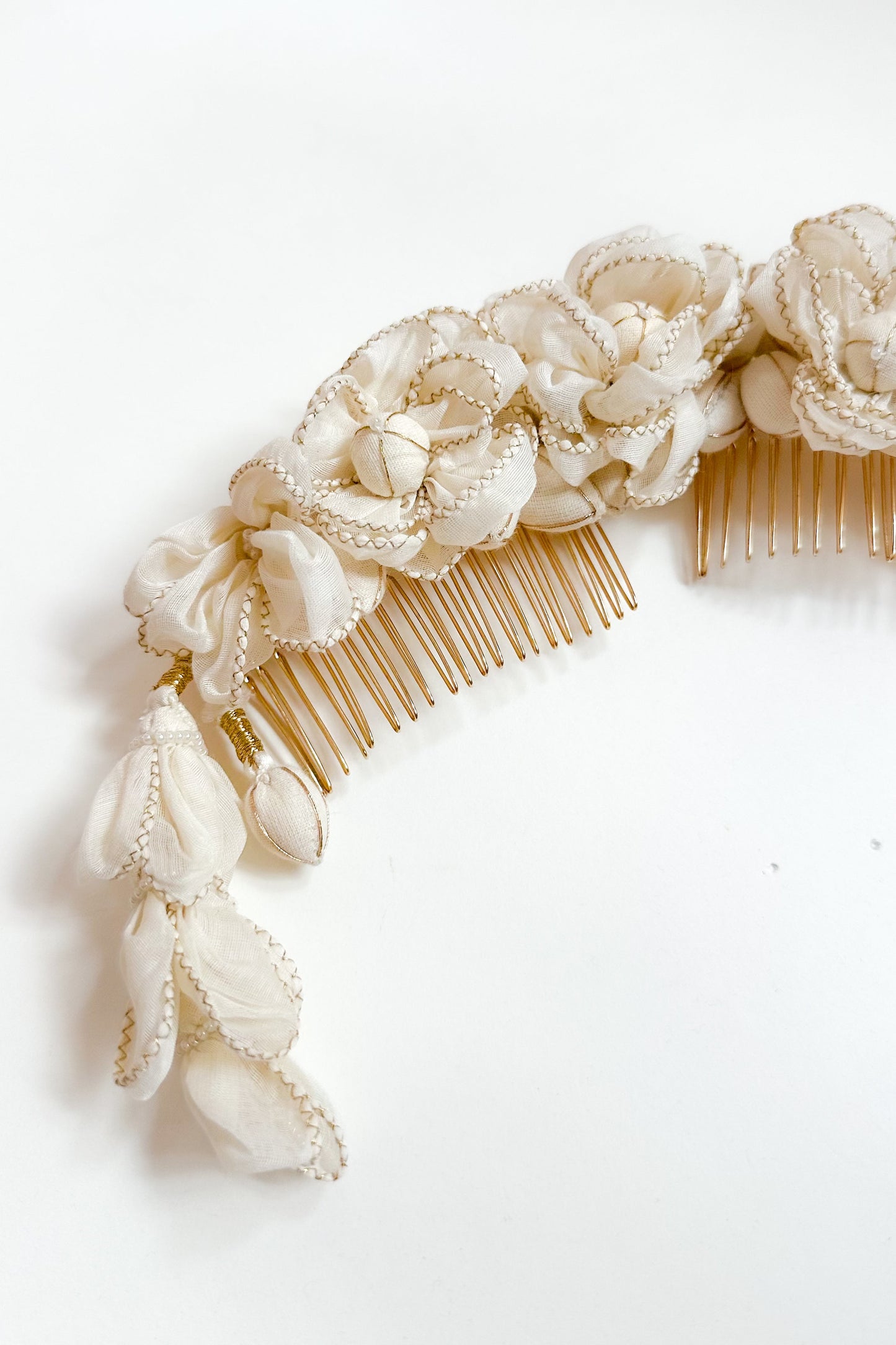 Decorative hair comb with floral embellishments on a white background