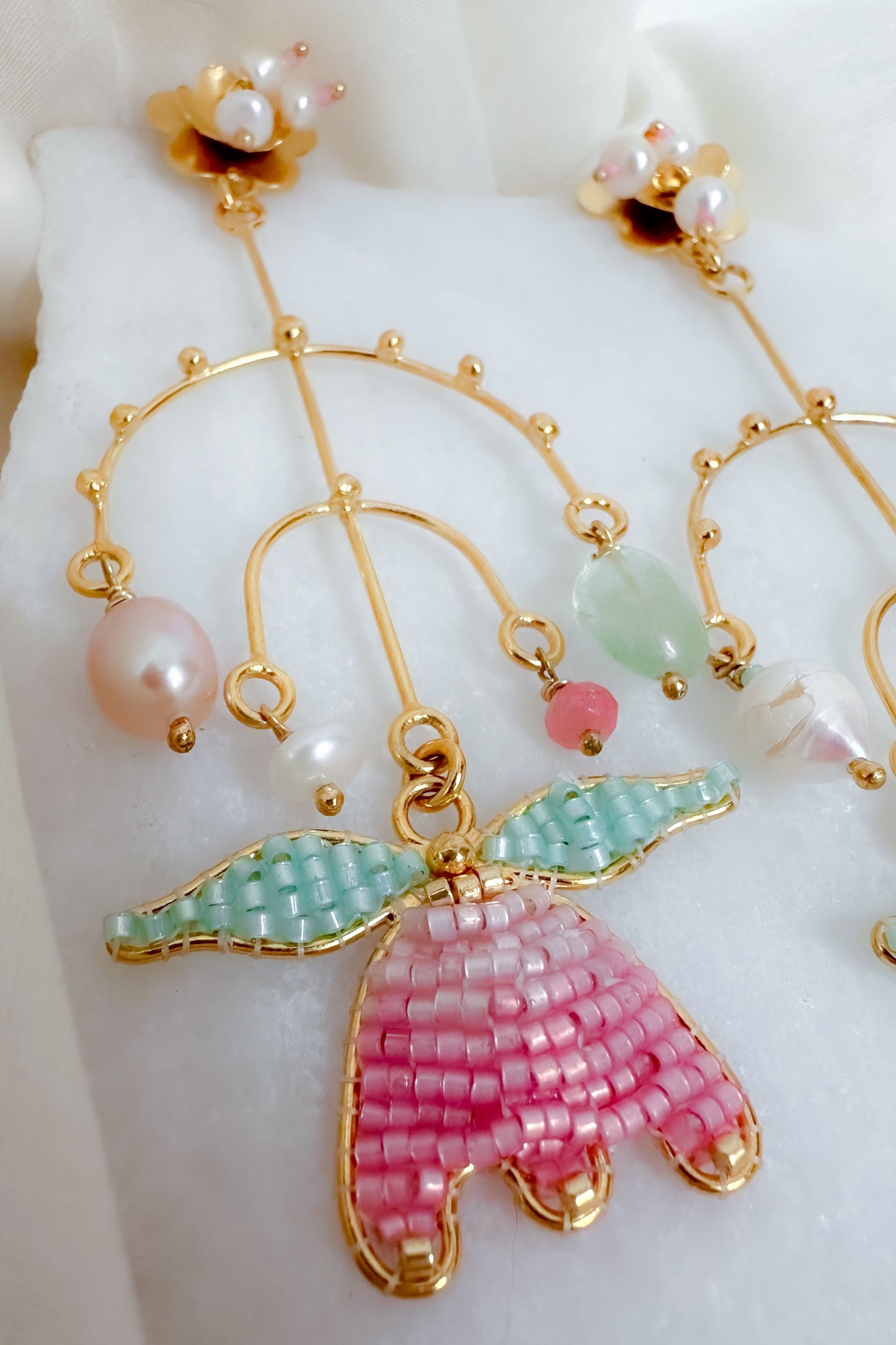 Closeup of beaded earrings with Pearls